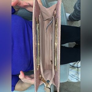 Call it spring, pink clutch bag